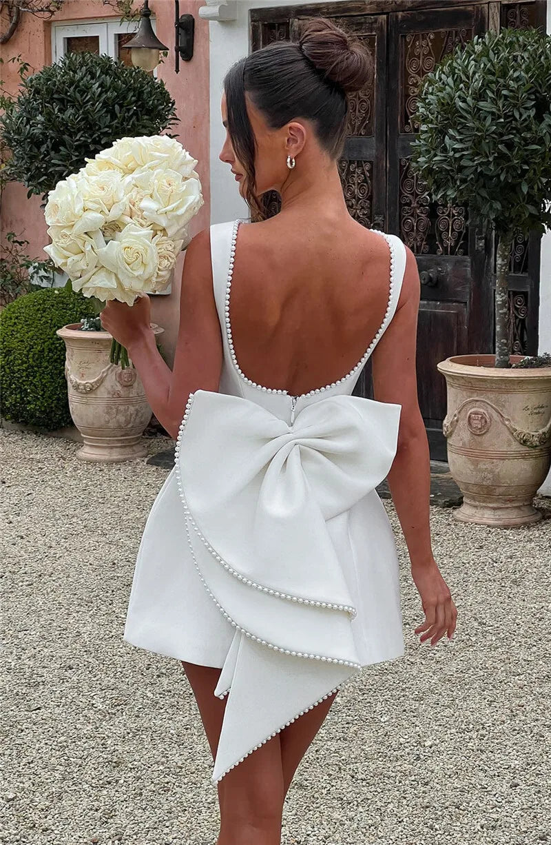 Mozision Pearl Bow Backless Sexy Mini Dress For Women Robe Fashion Zipper Sleeveless High Waist A-line Club Party Dress Elegant